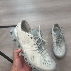 On Running Women's Sneakers in Light Gray and Off-White.    Sold at Depop